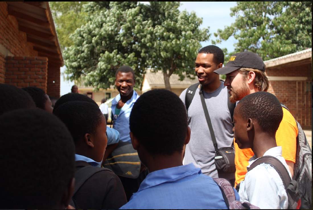 Coach Tafa with students in Malawi